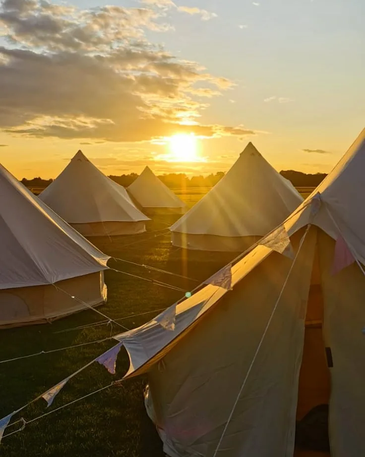 Bell tents at sunset